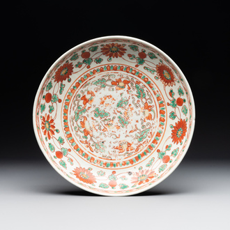 A Chinese red-and-green-enamelled 'chrysanthemum scroll' dish, Ming
