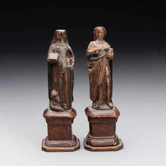 Two parcel-gilt and polychromed miniature oak sculptures of Saint John The Evangelist and Saint Catherine, 16th C.