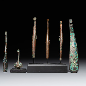 A varied collection of six Chinese bronze belt hooks, Warring States period and Western Han