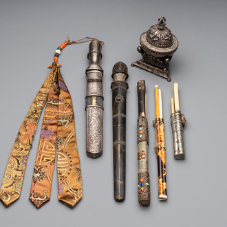 A varied collection of Chinese and Japanese eating set trousses, a Tibetan 'kapala' and two daggers, 18/19th C.