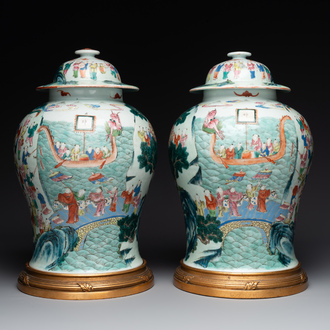 A pair of Chinese famille rose 'hundred boys' vases and covers on wooden stands, 19th C.