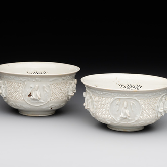 A pair of rare Chinese reticulated white-glazed biscuit 'Eight Immortals and Shoulao' bowls, Wanli