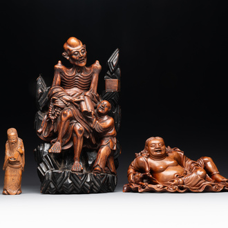 Two Chinese boxwood sculptures of Luohan and Liuhai and a bamboo sculpture of a sage, 17/19th C.