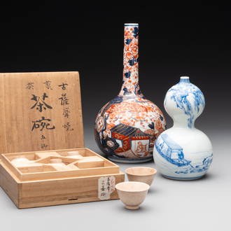 A Japanese blue and white gourd vase, an Imari bottle vase and a set of five Satsuma cups, 19th C.