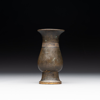 A rare Chinese parcel-gilt bronze ritual wine vessel, 'zhi 觯', Ming
