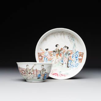 A Chinese famille rose cup and saucer with music making ladies, Yongzheng/Qianlong