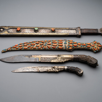 A varied collection of four decorated daggers, two inset with red coral and turquoise, Sri Lanka and Georgia, 18/19th C.