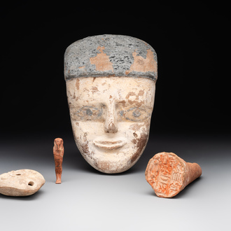 A death mask, a Ushabti, an oil lamp and a ritual cone with hieroglyphs, Egypt, 15th/1st C. B.C.