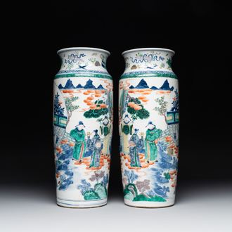 A pair of Chinese famille verte rouleau vases with narrative design, 19th C.