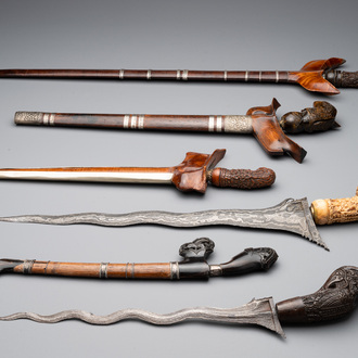 A collection of six krises with carved handles, four with scabbard, Indonesia, 19th C.