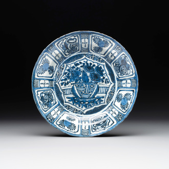 A Chinese blue and white kraak porcelain dish with flowers in a jardiniere, Wanli
