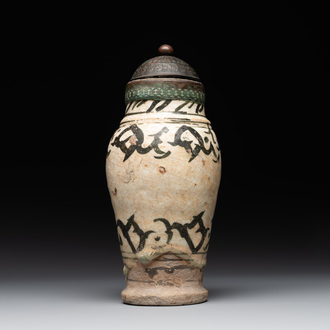 An early Islamic pottery albarello with engraved copper mount and cover, probably Nishapur, Iran, 10/11th C.