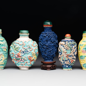 Five Chinese moulded famille rose snuff bottles, Qianlong mark, 19th C.