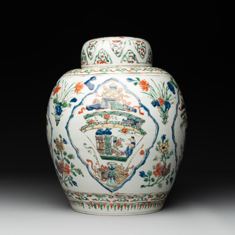 A Chinese famille verte 'figures and antiquities' jar and cover, Kangxi