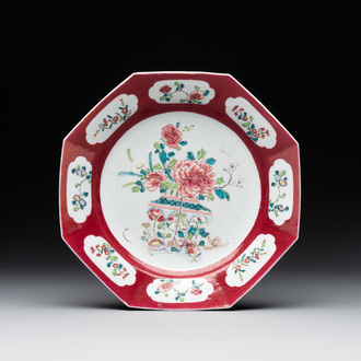 A Chinese octagonal famille rose ruby border plate with a flower basket, Yongzheng