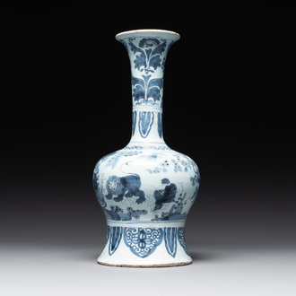 A blue and white Dutch Delft bottle-shaped chinoiserie vase with a lion, 17th C.