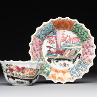 A Chinese famille rose cup and saucer with a reclined lady, Qianlong