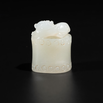 A Chinese white jade carving of a chilong reclining on bamboo, Qing