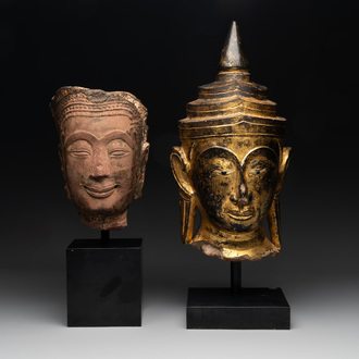 A Thai red sandstone head of Buddha and a lacquered and gilt stone head of Buddha, possibly Ayutthaya period, 15th C.