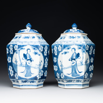 A pair of Chinese blue and white hexagonal jars and covers with a lady holding a fan, 19th C.