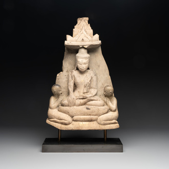 A Burmese limestone stele with Buddha and two attendants with traces of gilding, 19th C.