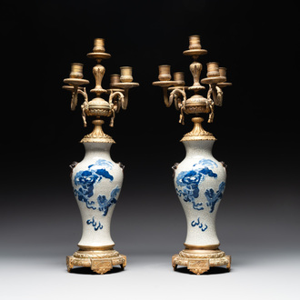 A pair of Chinese blue and white Nanking crackle-glazed vases with gilt bronze candelabra mounts, 19th C.