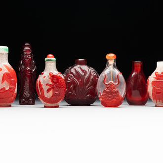 A group of seven Chinese red-overlay glass and red glass snuff bottles, 19/20th C.