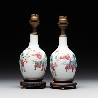 A pair of Chinese famille rose vases with figural design mounted as lamps, 19th C.
