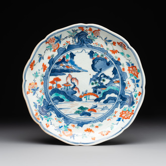 A Japanese Hizen ware Kakiemon-style 'riverside landscape' plate, Edo, 17/18th C.