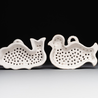 Two white-glazed pottery strainers in the shape of a dove and a whale, France, 18th C.