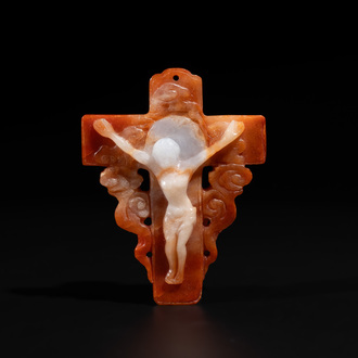 A Chinese white and red jade 'crucifix' pendant, 19th C.