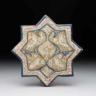 An intact Kashan lustre-glazed star tile, Persia, 13/14th C.