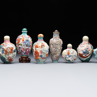 Eight Chinese moulded famille rose snuff bottles, Qianlong mark, 19th C.