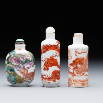 Three Chinese famille rose and iron-red 'Buddhist lion' and 'dragon' snuff bottles, 19th C.