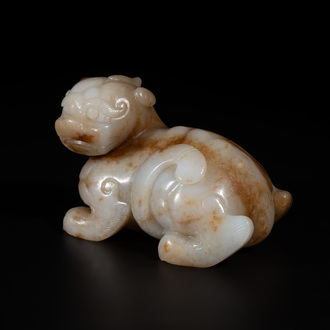 A large Chinese white and russet jade sculpture of a mythical beast, 17/18th C.