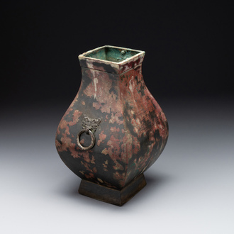 A Chinese archaic bronze vase with 'Taotie' handles, 'fang hu 方壺', Han