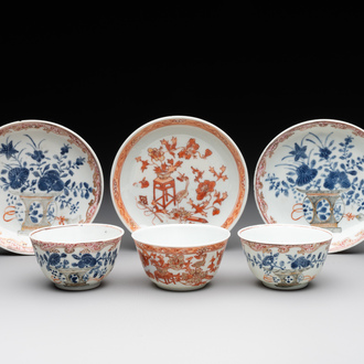 A pair of Chinese polychrome-decorated cups and saucers and an iron-red gilt-decorated cup and saucer, Yongzheng/Qianlong