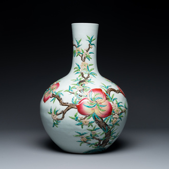 A Chinese famille rose relief-moulded 'tianqiuping' vase with nine peaches, Qianlong mark, 19/20th C.
