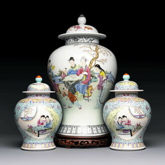 A Chinese famille rose covered vase and a pair of small covered vases, Qianlong mark, 20th C.