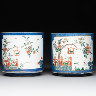 A pair of Chinese powder blue-ground famille verte vessels with a bird in a garden, Kangxi