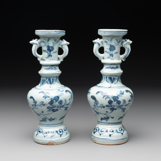 A pair of Chinese blue and white handled vases with floral design, Ming