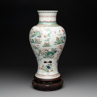 A fine Chinese famille verte 'mythical creatures' vase on a reticulated wooden stand, Kangxi