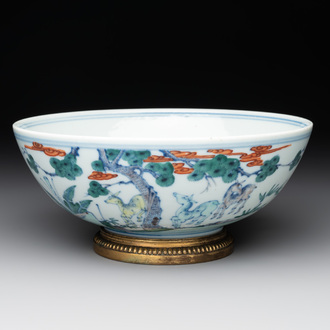 A Chinese doucai 'deer' bowl with gilt bronze stand, Chenghua mark, 18th C.