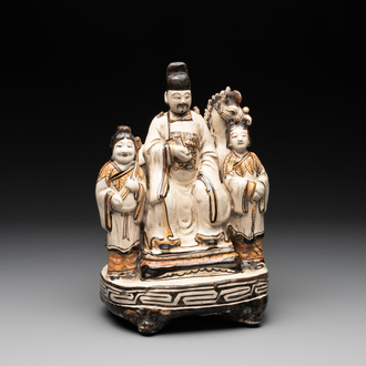 A rare Chinese Cizhou group with a dignitary, two attendants and a horse, Ming