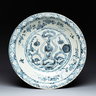 A Chinese Swatow blue and white dish with stylised floral design, Ming