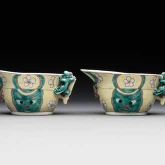 A pair of fine Chinese sancai-glazed 'Buddhist lion and chilong' libation cups, Kangxi