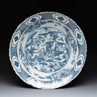 A Chinese Swatow blue and white dish with deer in a landscape, Ming