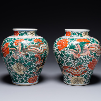 A pair of Chinese wucai 'phoenix and peony scroll' vases, Transitional period