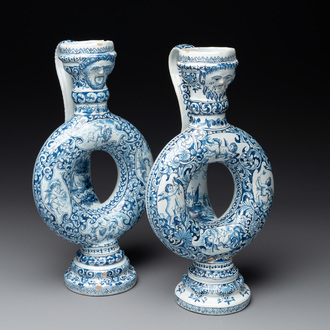 A pair of blue and white Dutch Delft circular jugs, 19th C.