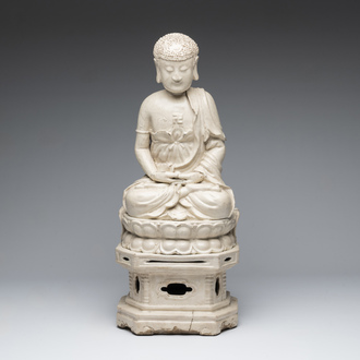 An extremely rare Chinese Swatow cream-glazed seated Buddha, Xuande mark, Ming